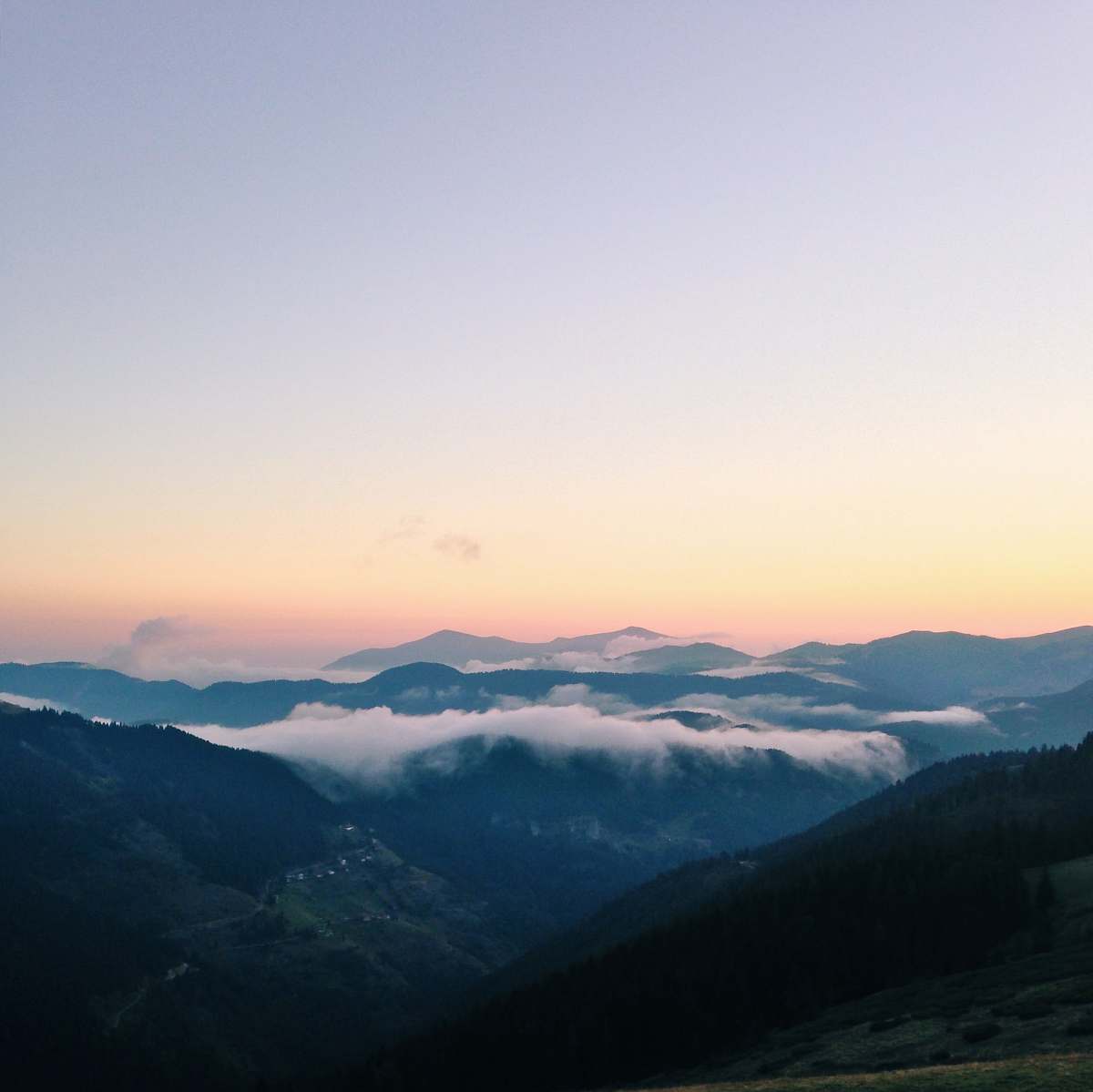 sunset green mountains with fog during golden hour mountains