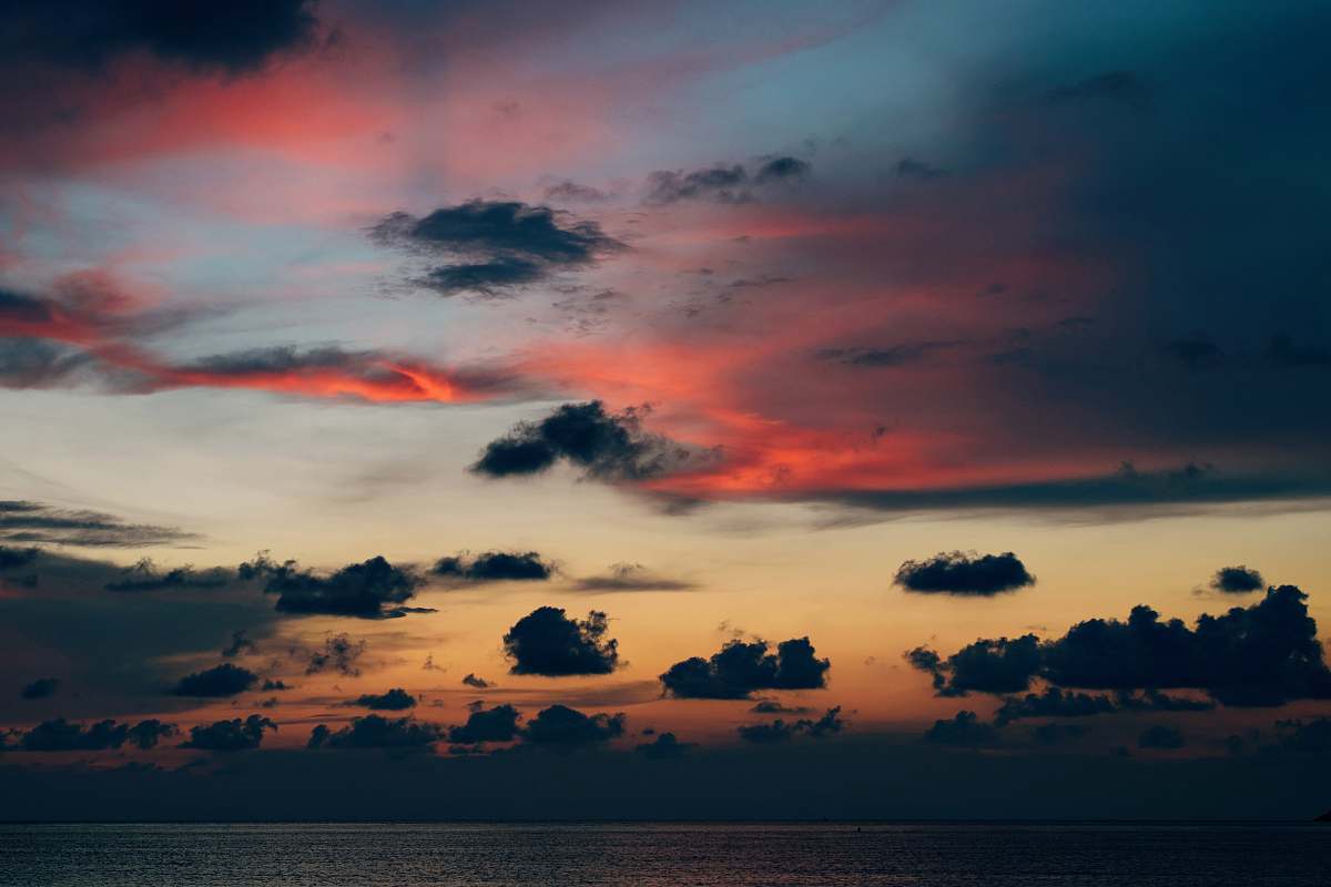 sunset low angle photo of black clouds during golden hour dusk
