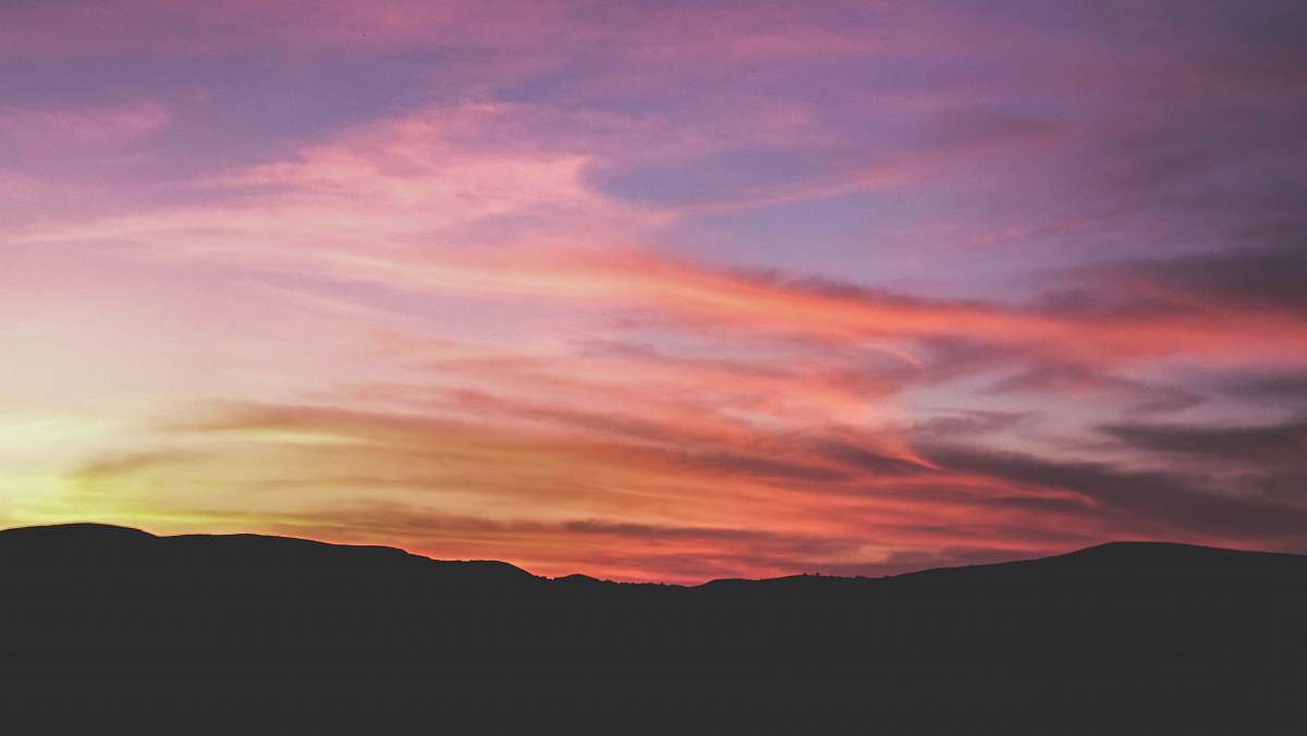 sunset mountain silhouette during sunset red sky