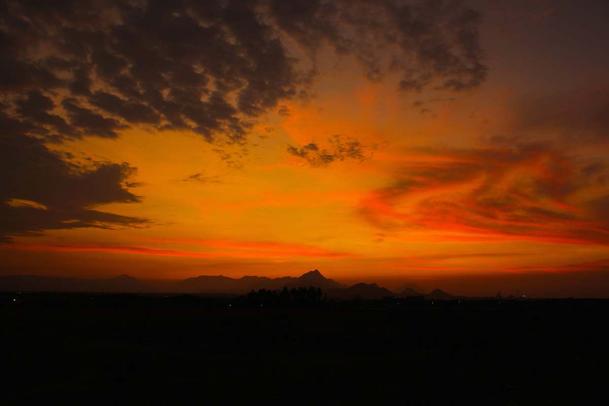 sunrise mountains under orange kies sunset