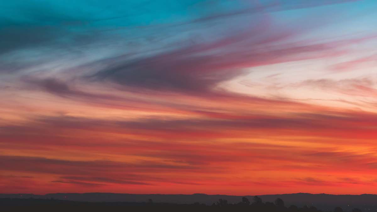 sunset orange and gray clouds during golden hour sunrise