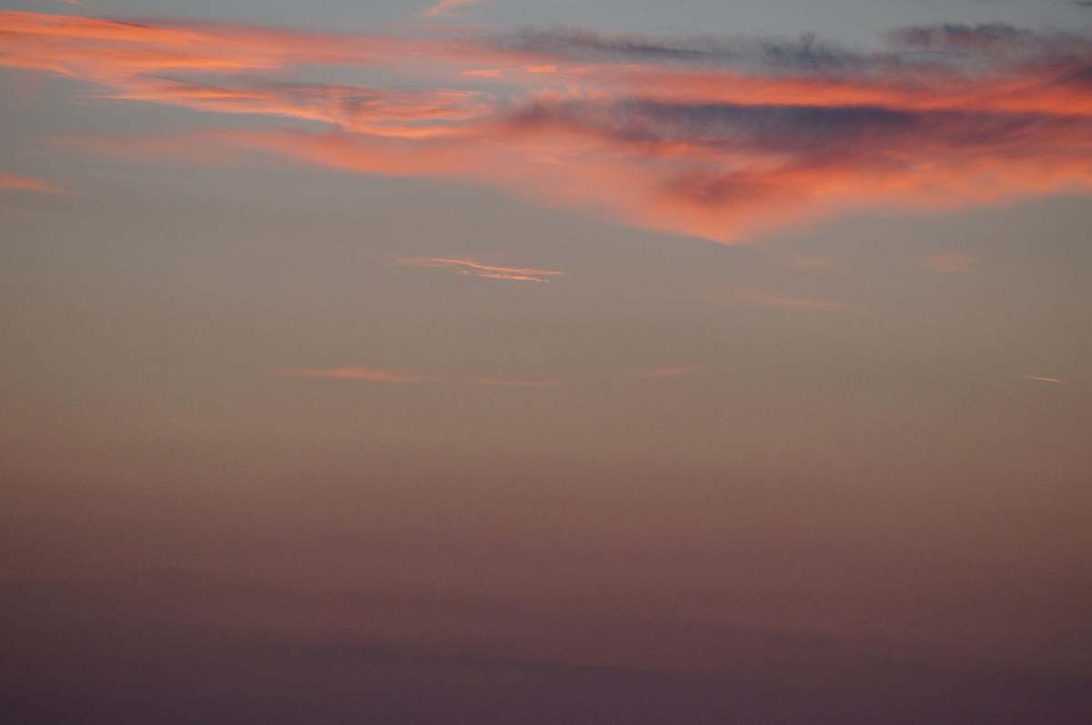 sunset orange clouds on clear sky dusk