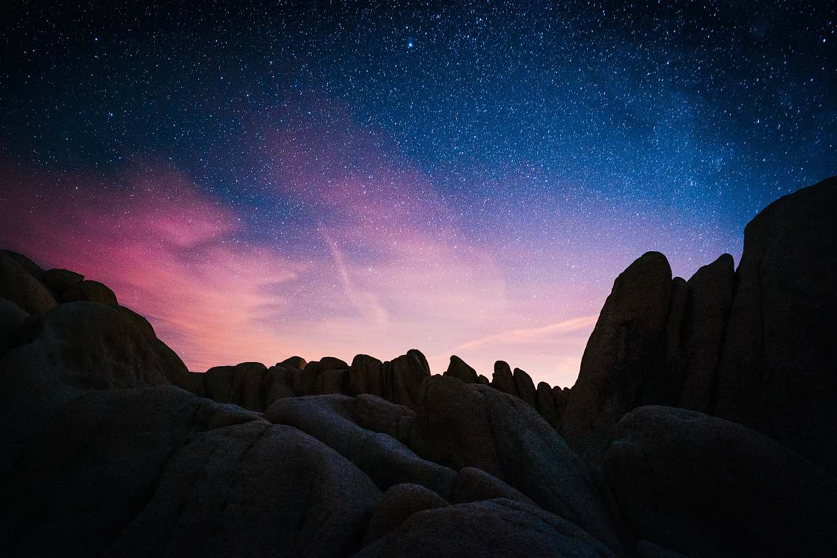 night rock mountain during starry night space