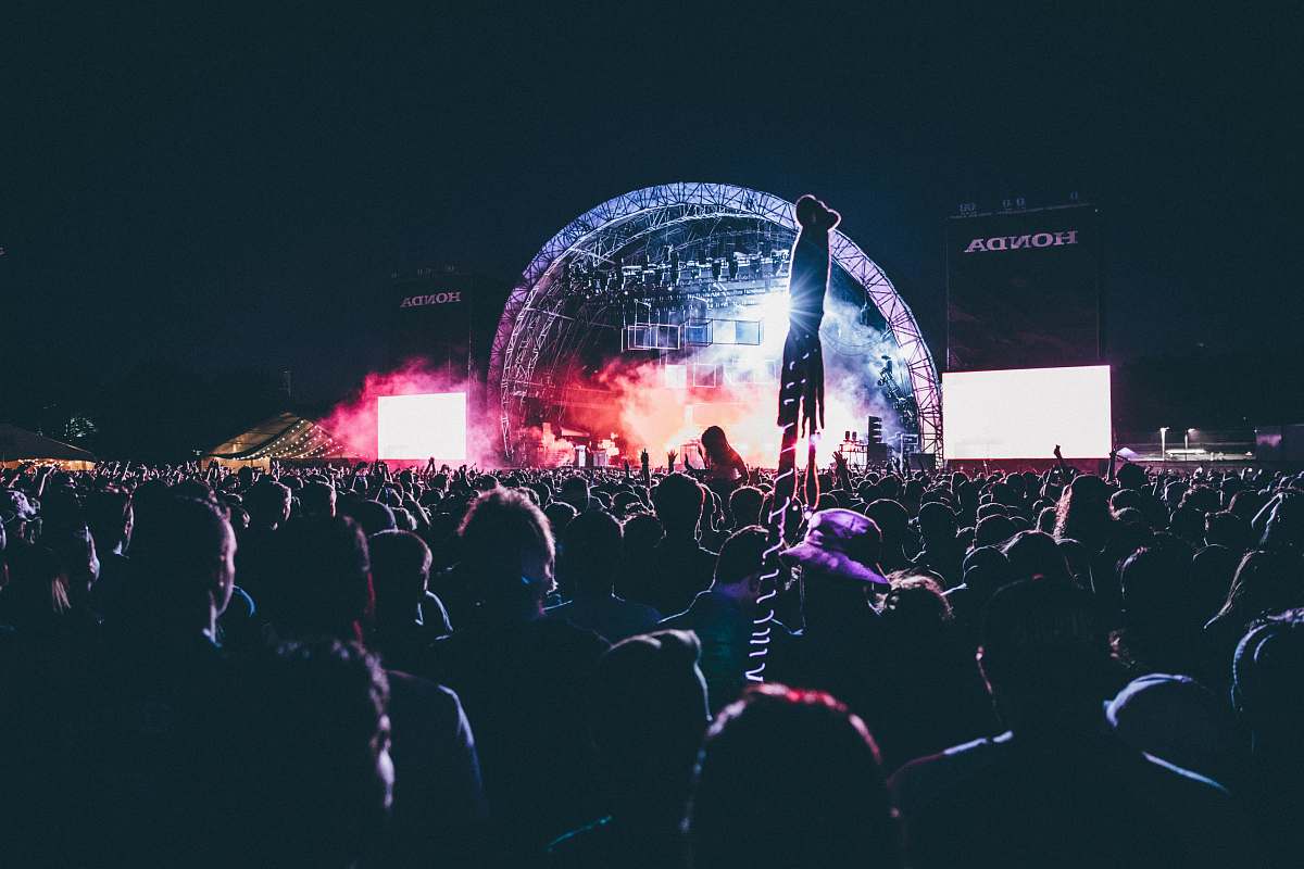 festival photo of crowd of people in a concert crowd