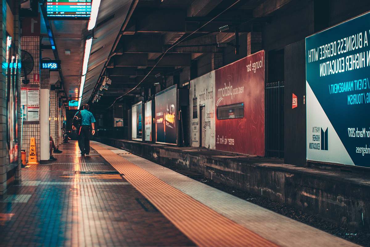 underground man walking in subway train