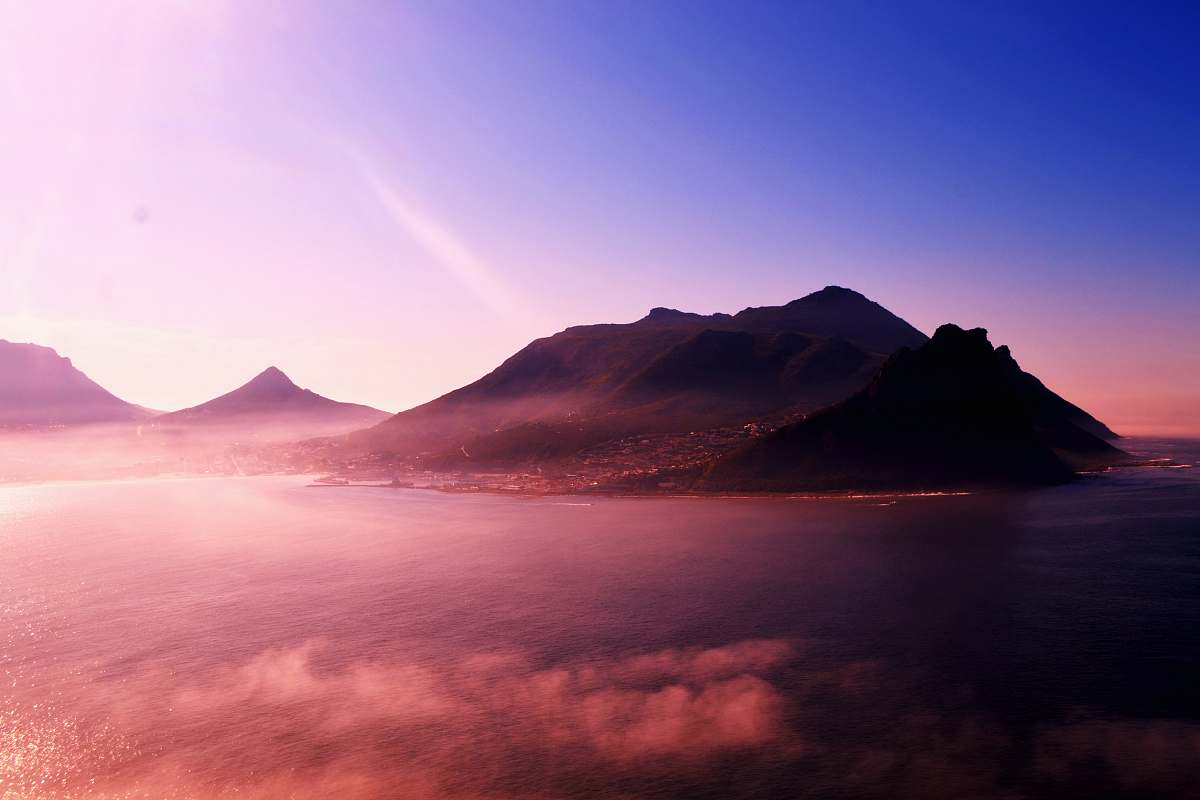 sunrise mountain near body of water under blue sky hout bay