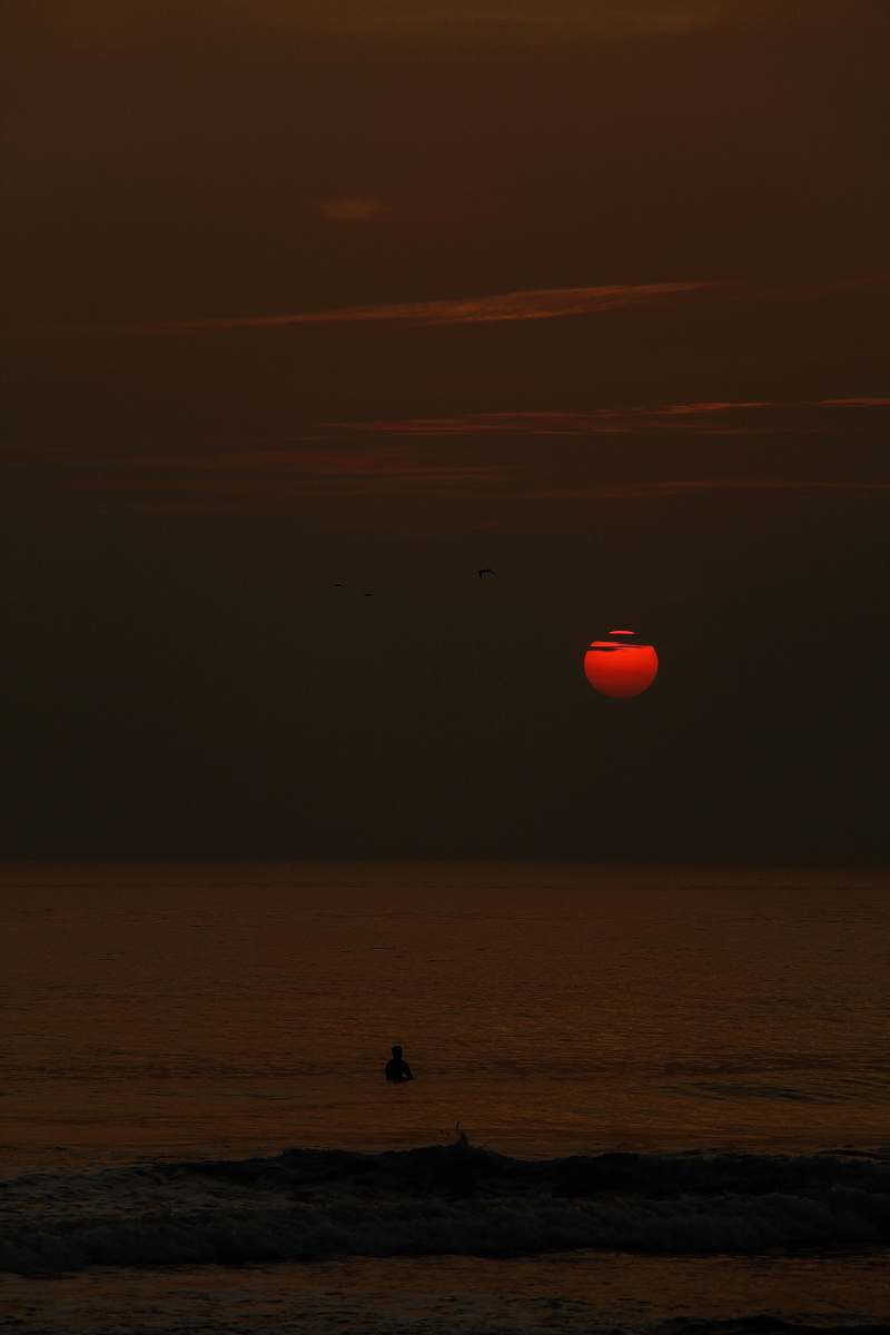 nature red sunset over a beach outdoors