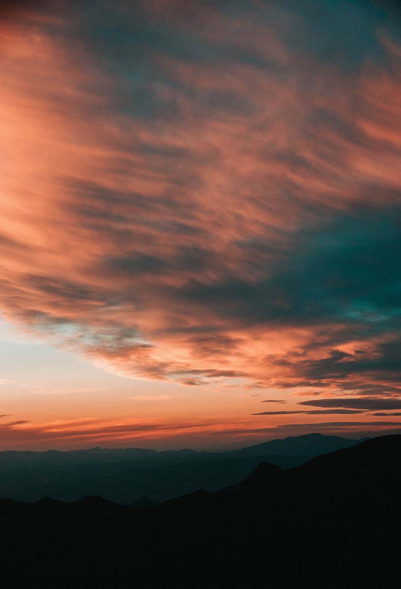 nature silhouette of mountains under cloudy sky during daytime outdoors