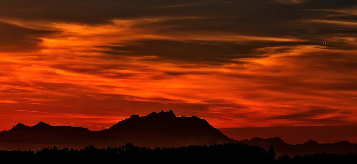 sky silhouette on mountain during red sky sunrise