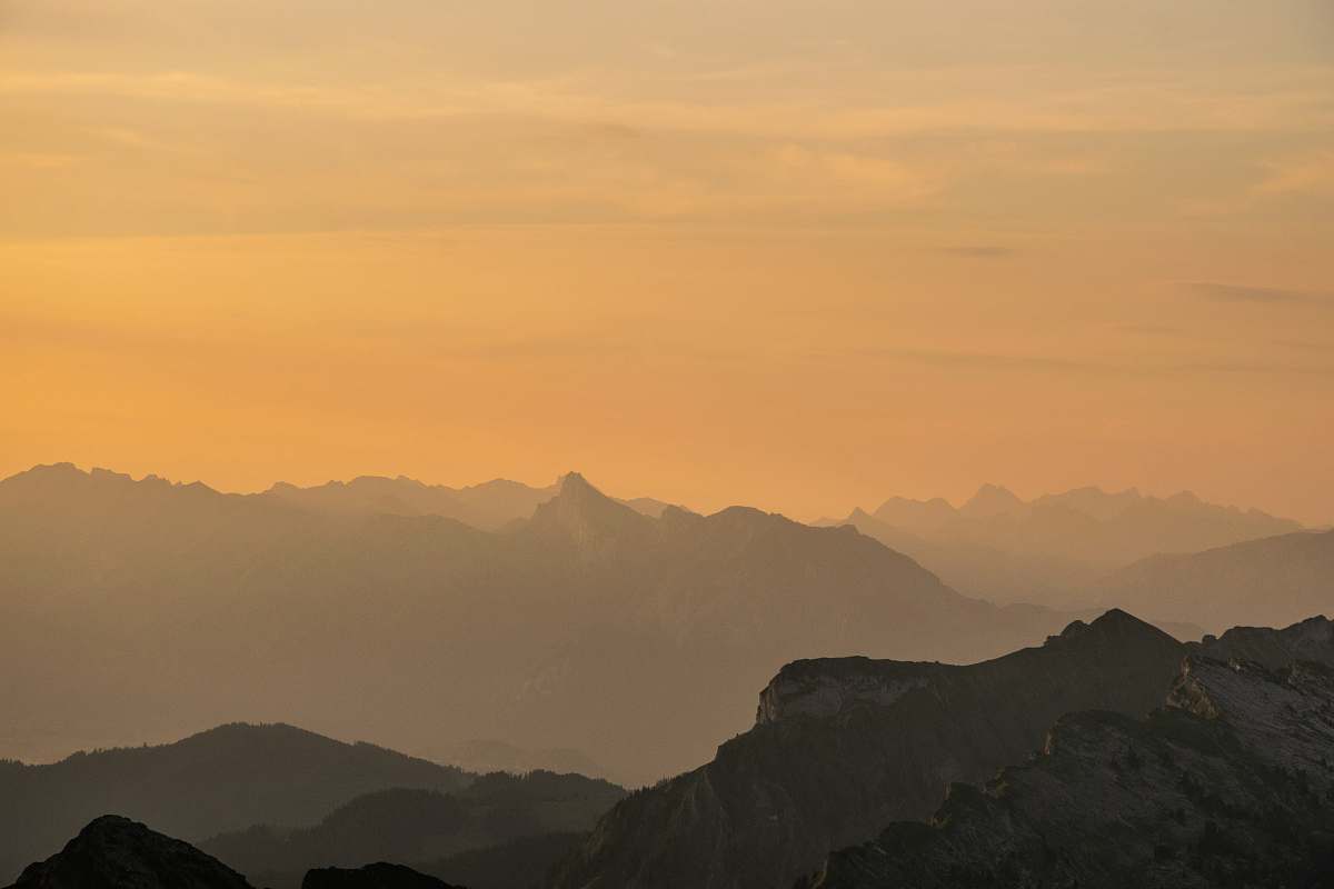 sky sunrise over mountains during foggy day switzerland