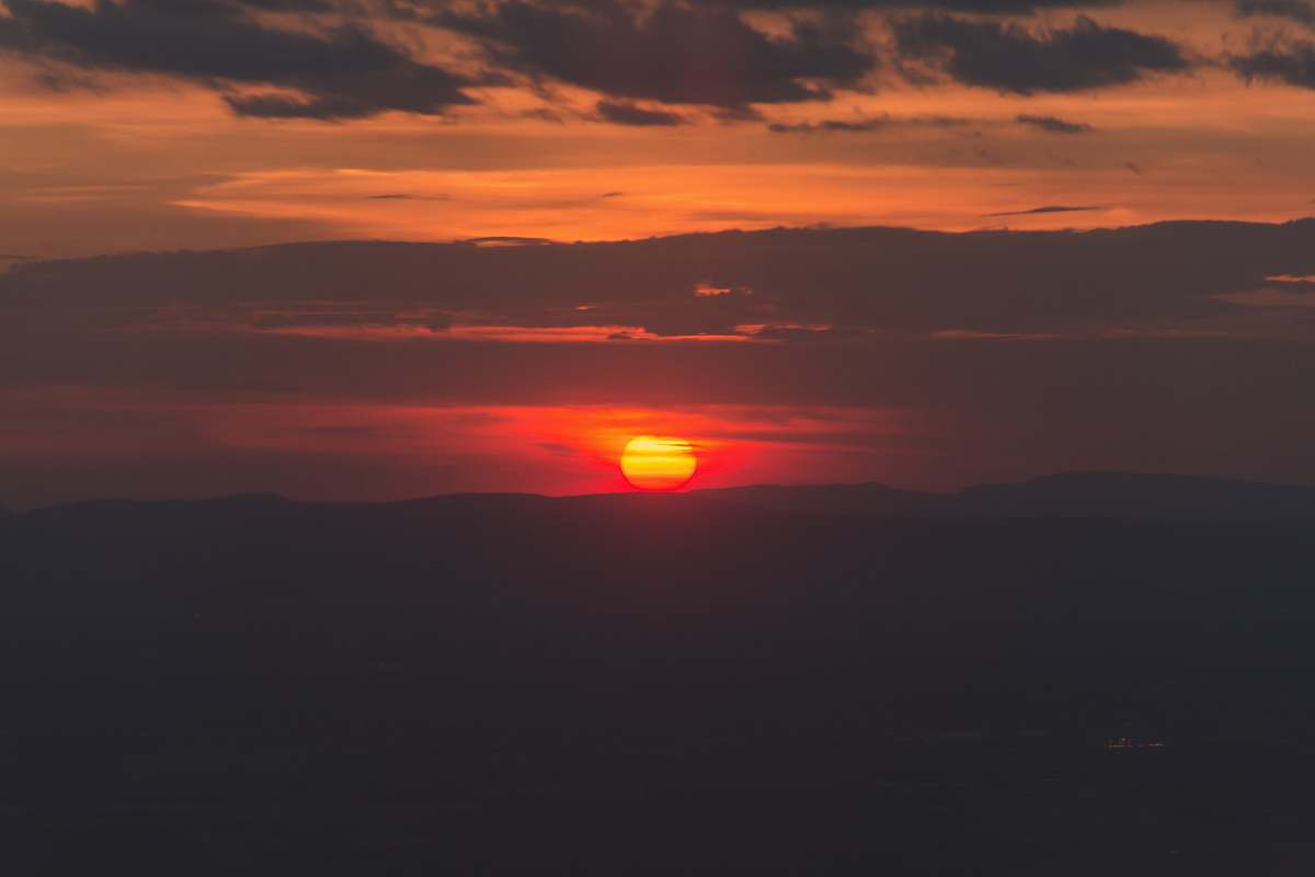 sunrise sunset under cloudy sky sun