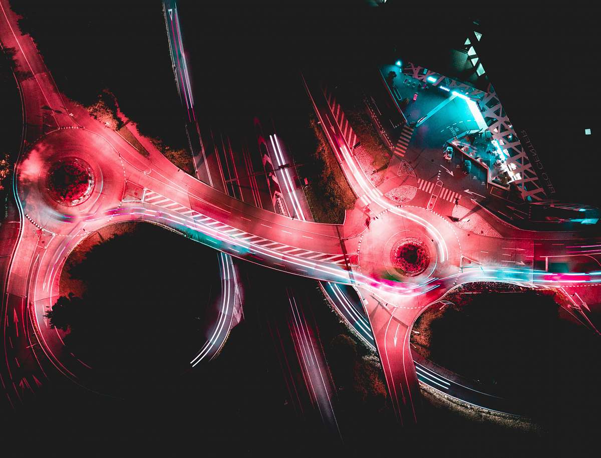 road aerial photograph of cable bridges neon
