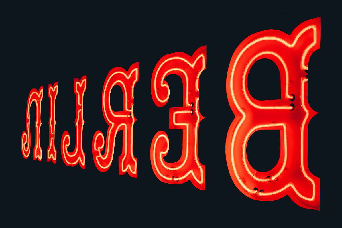 text turned on red Berlin neon signage number