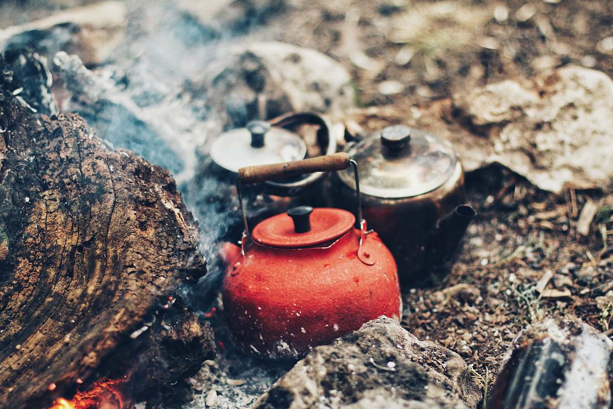 camp three red and gray kettles on charcoals tea kettle