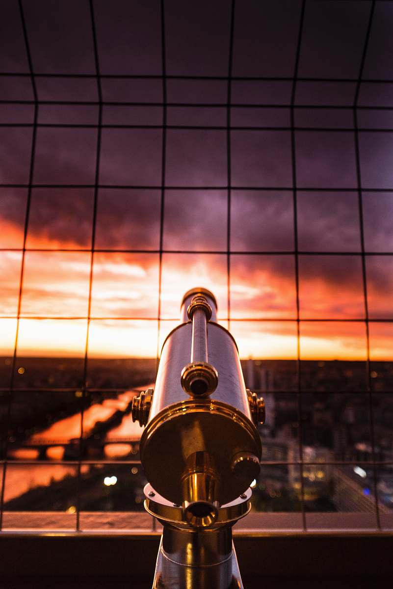 paris gray and yellow telescope against grill france