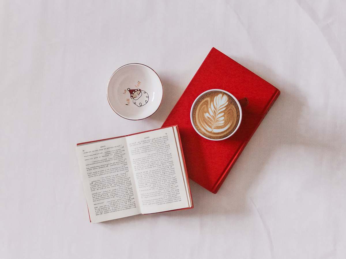 read white ceramic mug reading