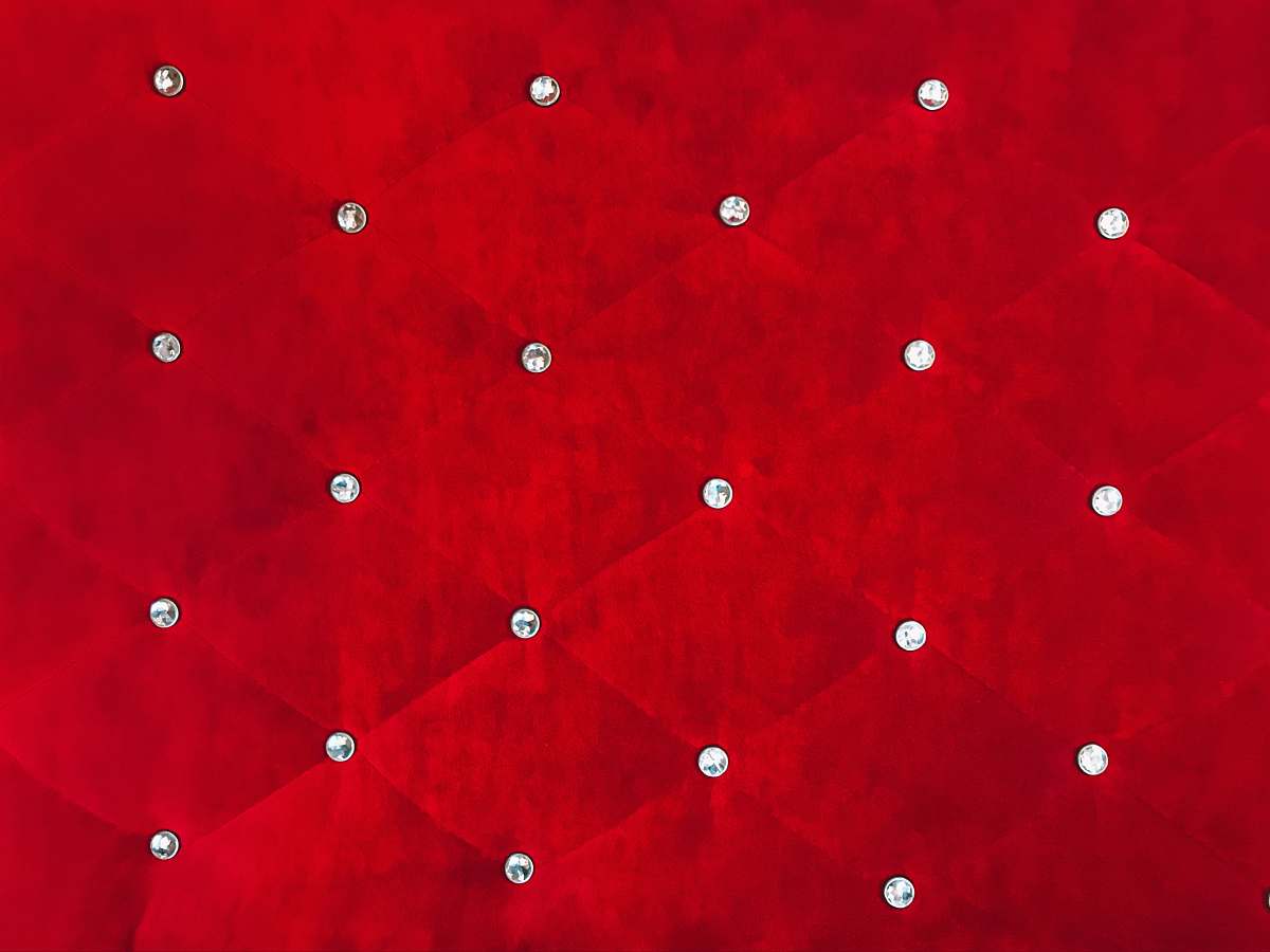 red quilted red textile diamons