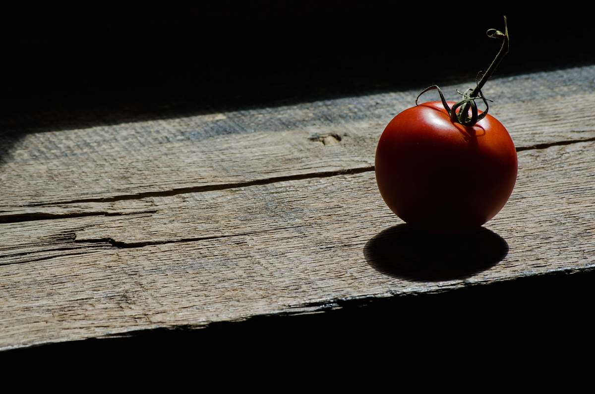 flora red tomato on brown wooden table food