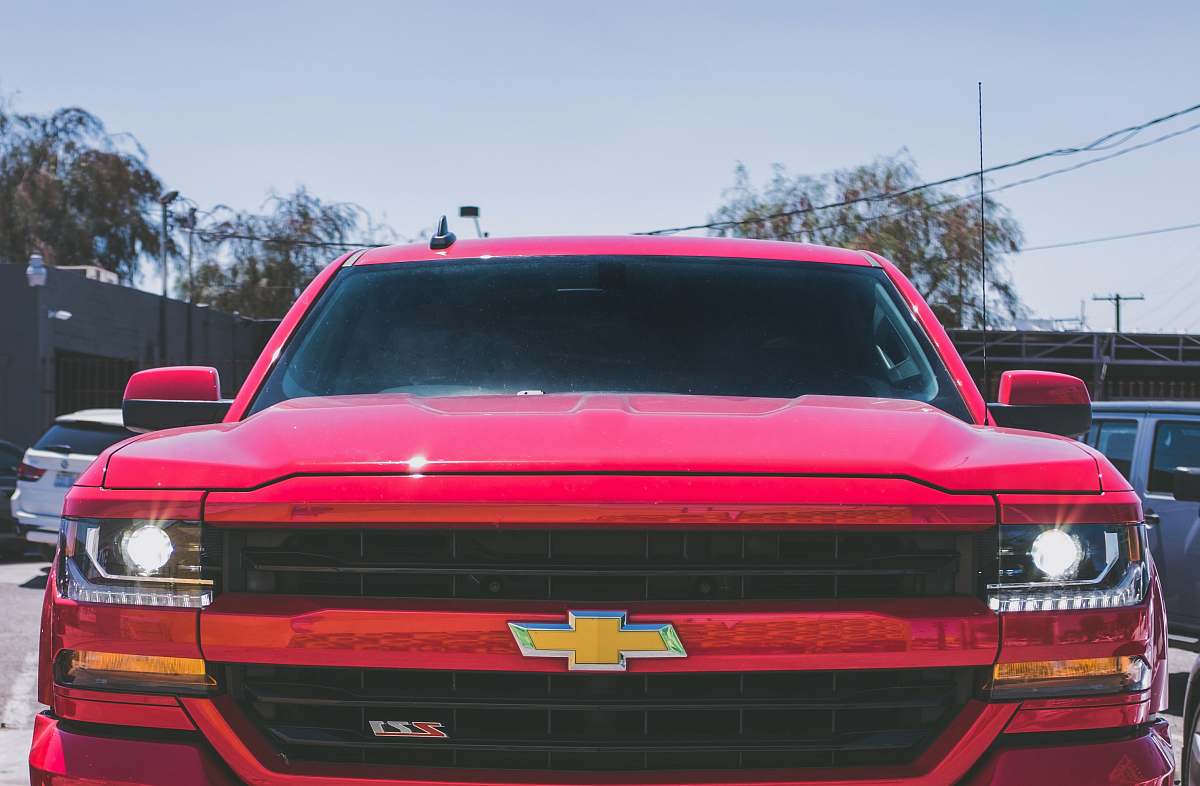 car red Chevrolet car vehicle