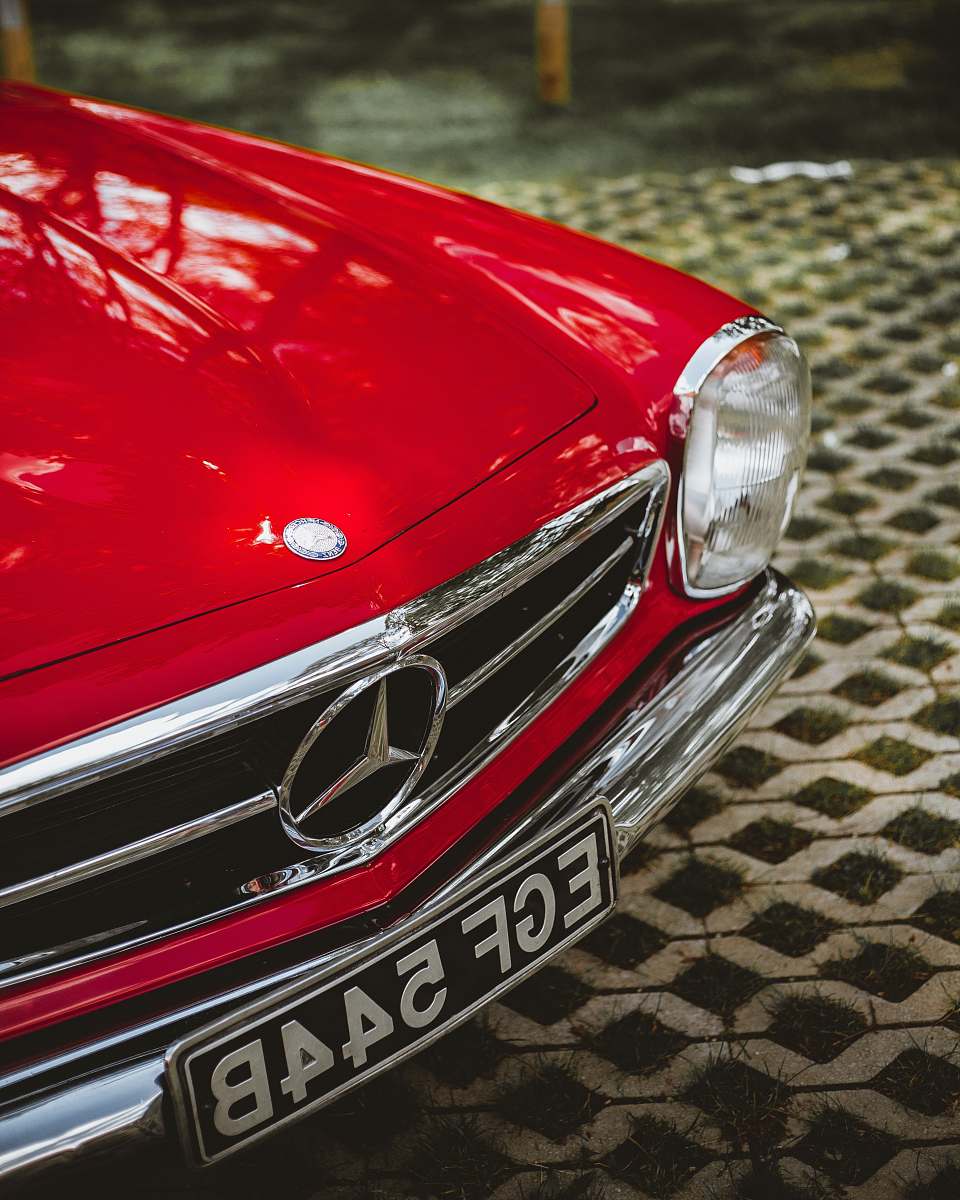 automobile shallow focus photo of red Mercedes-Benz car car