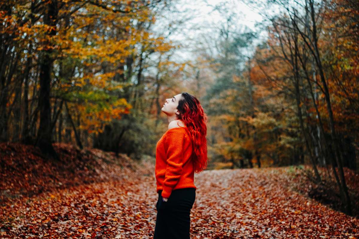apparel woman wearing orange sweater during daytime clothing