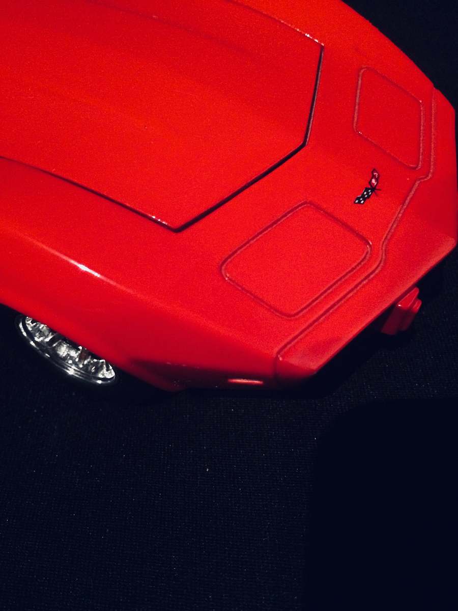car red Corvette on black surface transportation