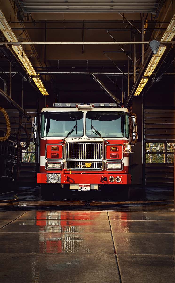 engine red firetruck on garage truck