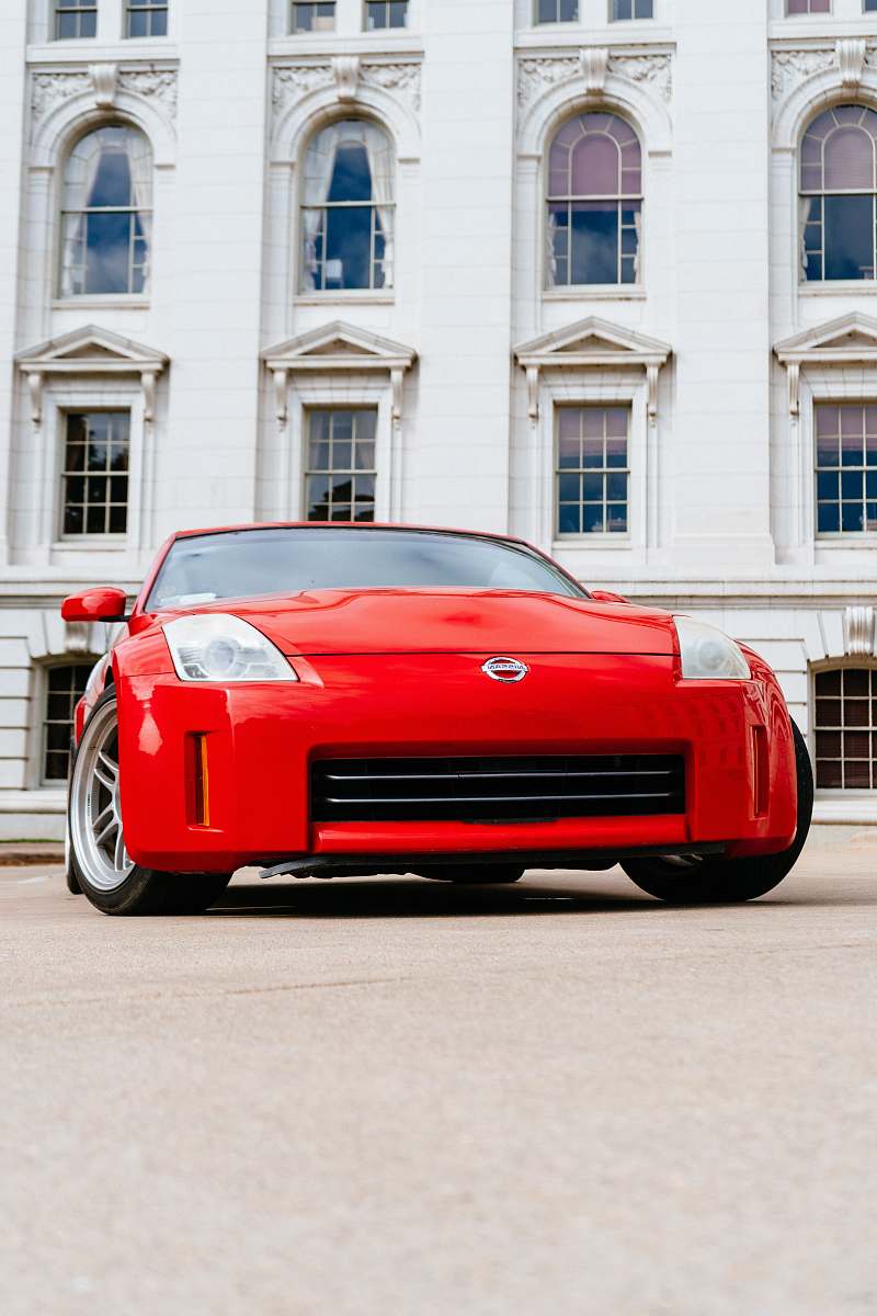 car red Nissan vehicle transportation
