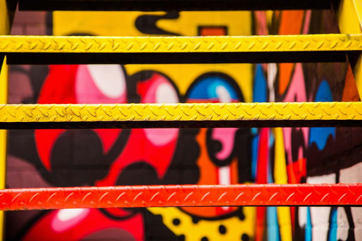 step red and yellow painted metal stairs art