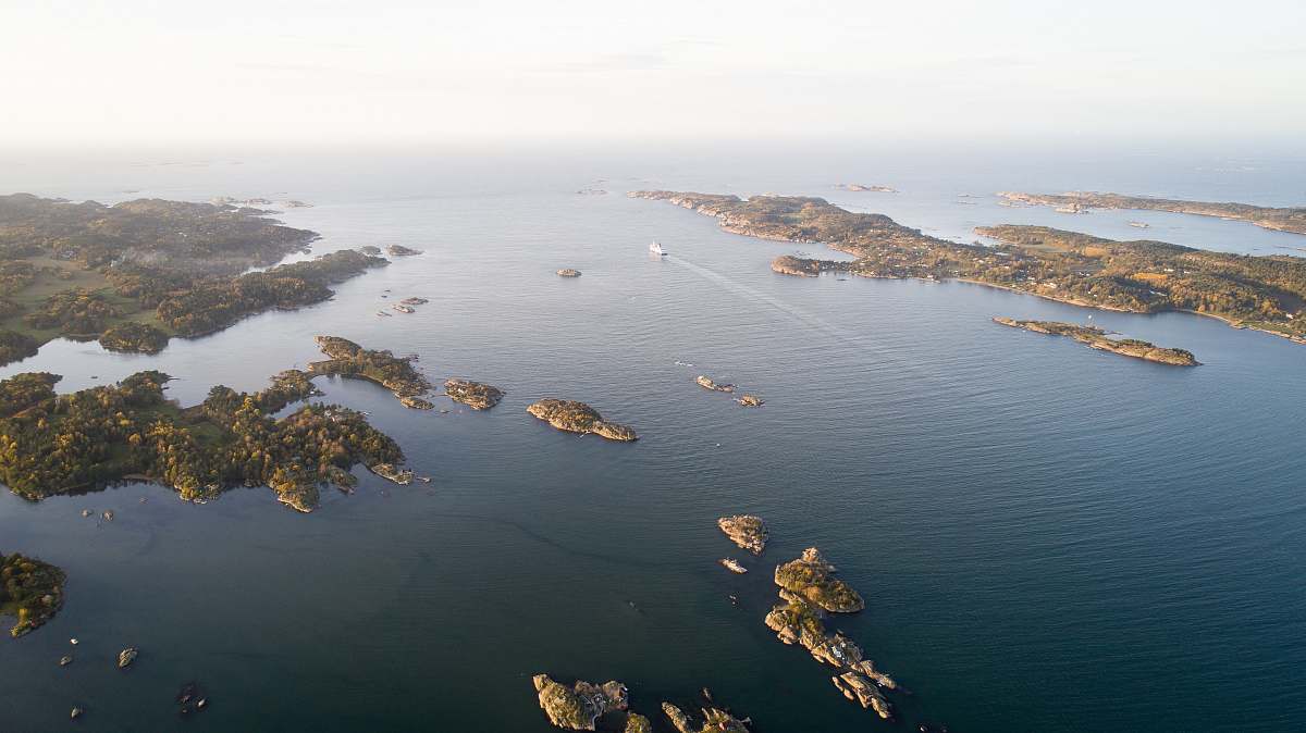 grey aerial photography of island during daytime ocean