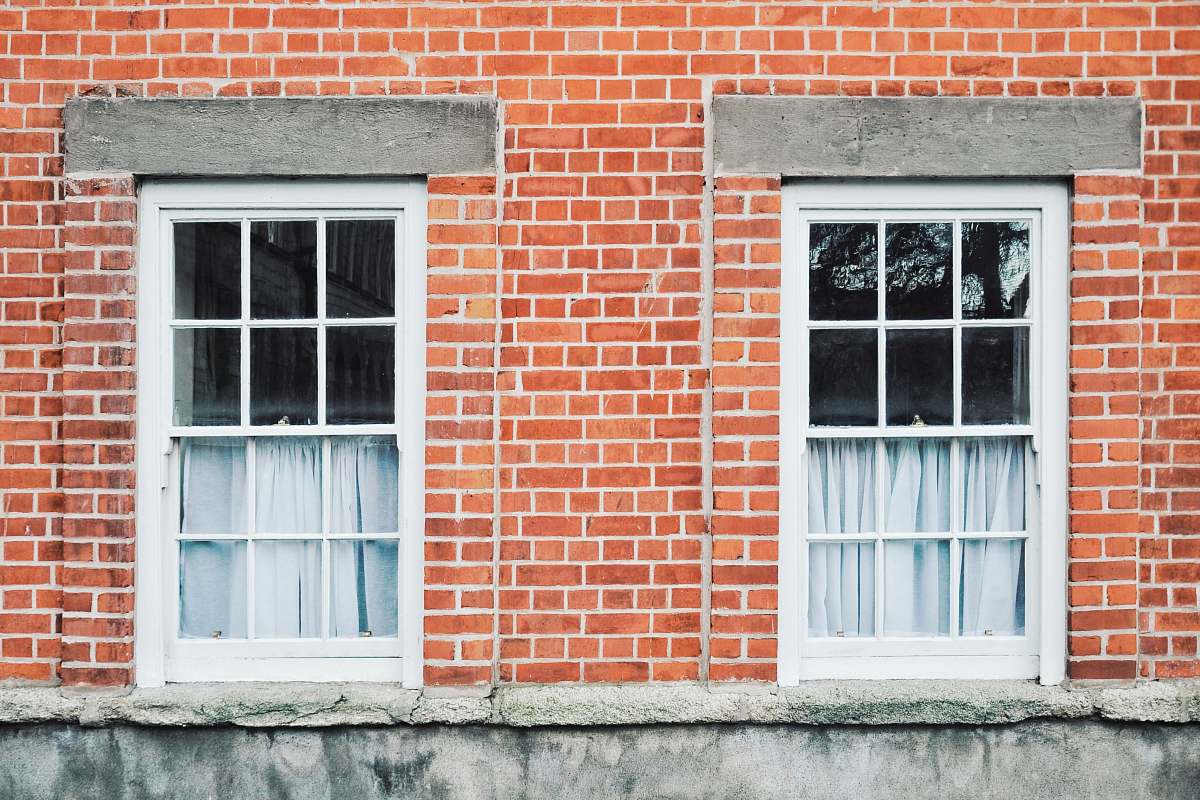 brick two white wooden windowpanes dublin