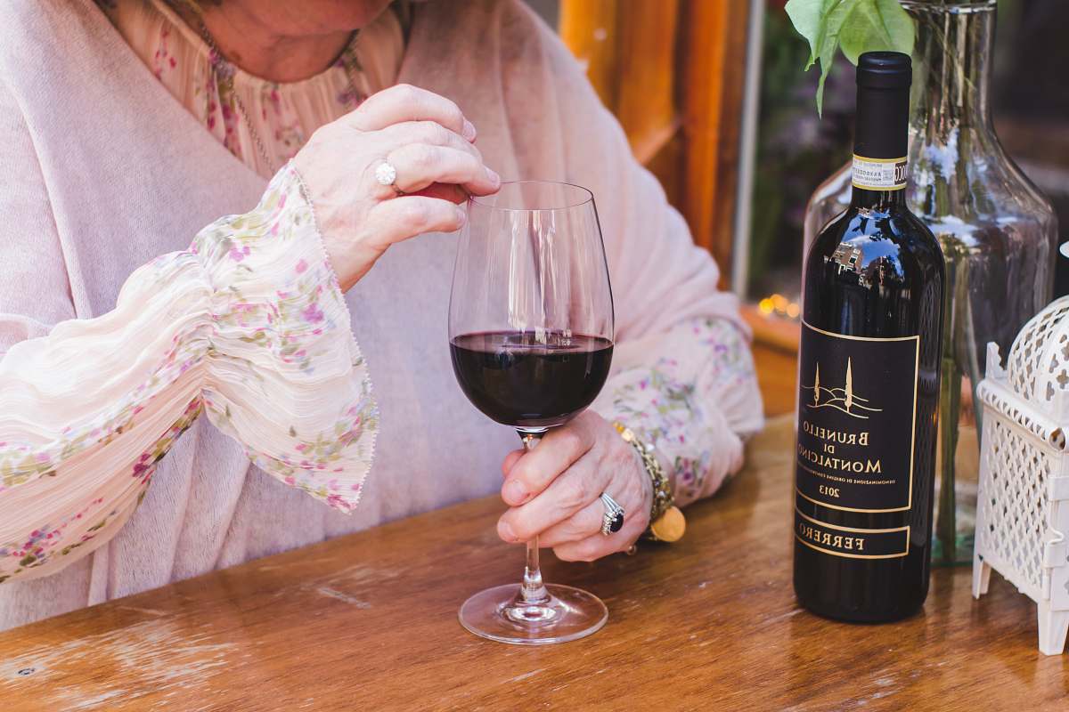 alcohol woman holding a glass of wine on the table drink