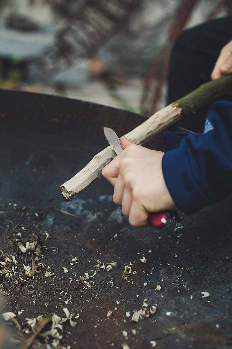 people man carving stick person