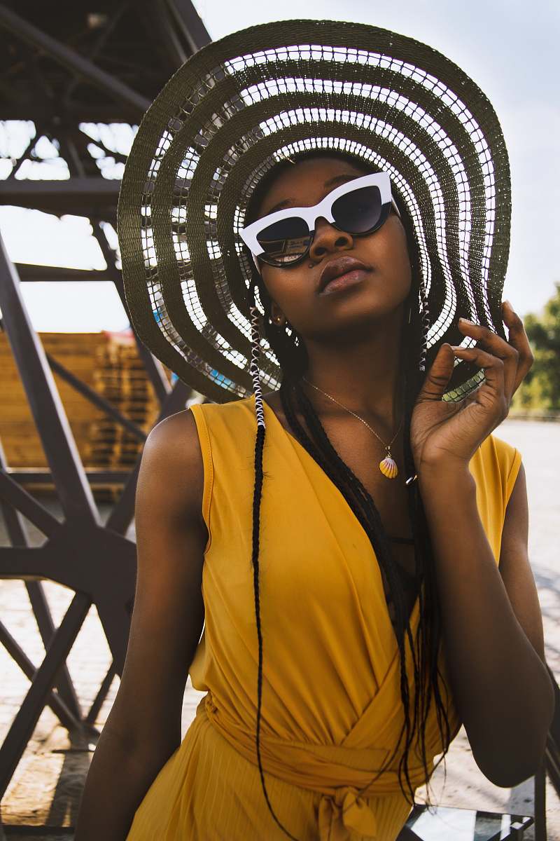 people woman in yellow sleeveless dress taking selfie person