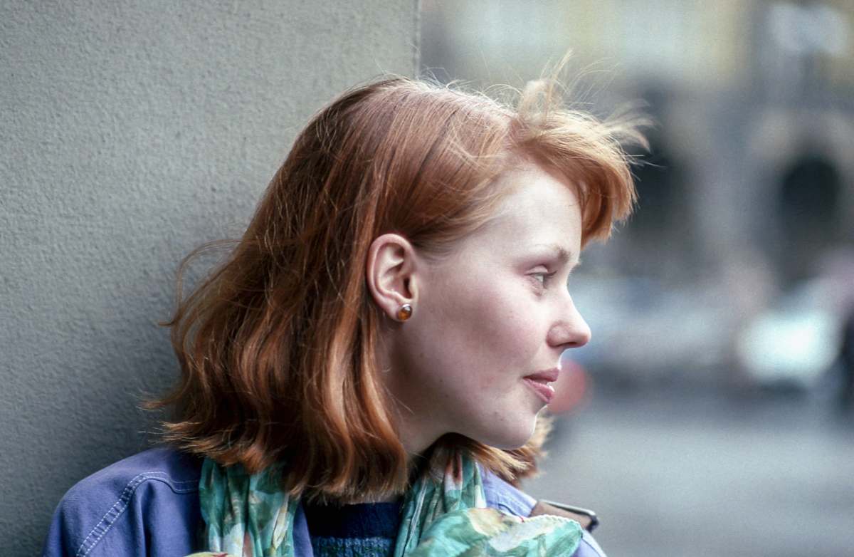 person close-up photography of woman looking outside human