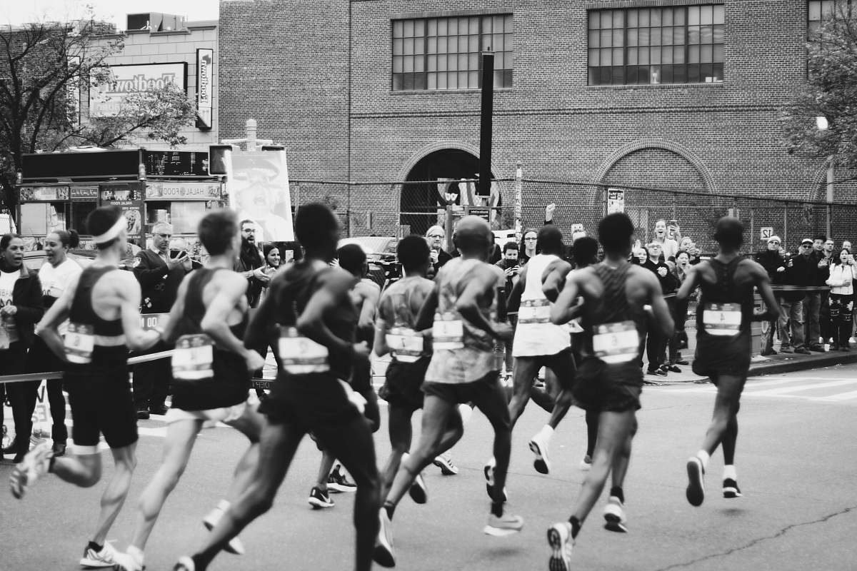 black-and-white grayscale photo of men running on marathon running