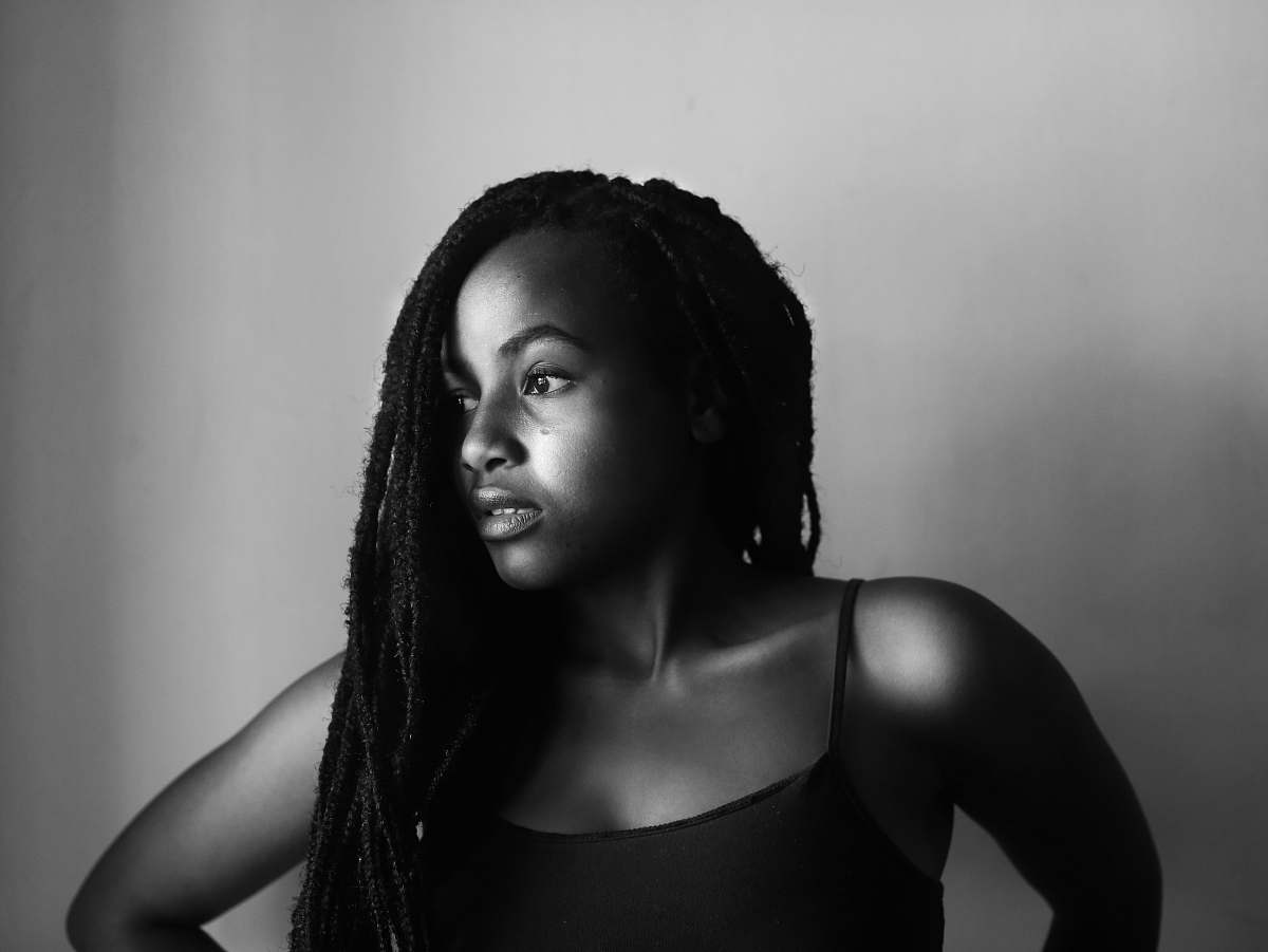 human grayscale photography of woman looking on her side black-and-white