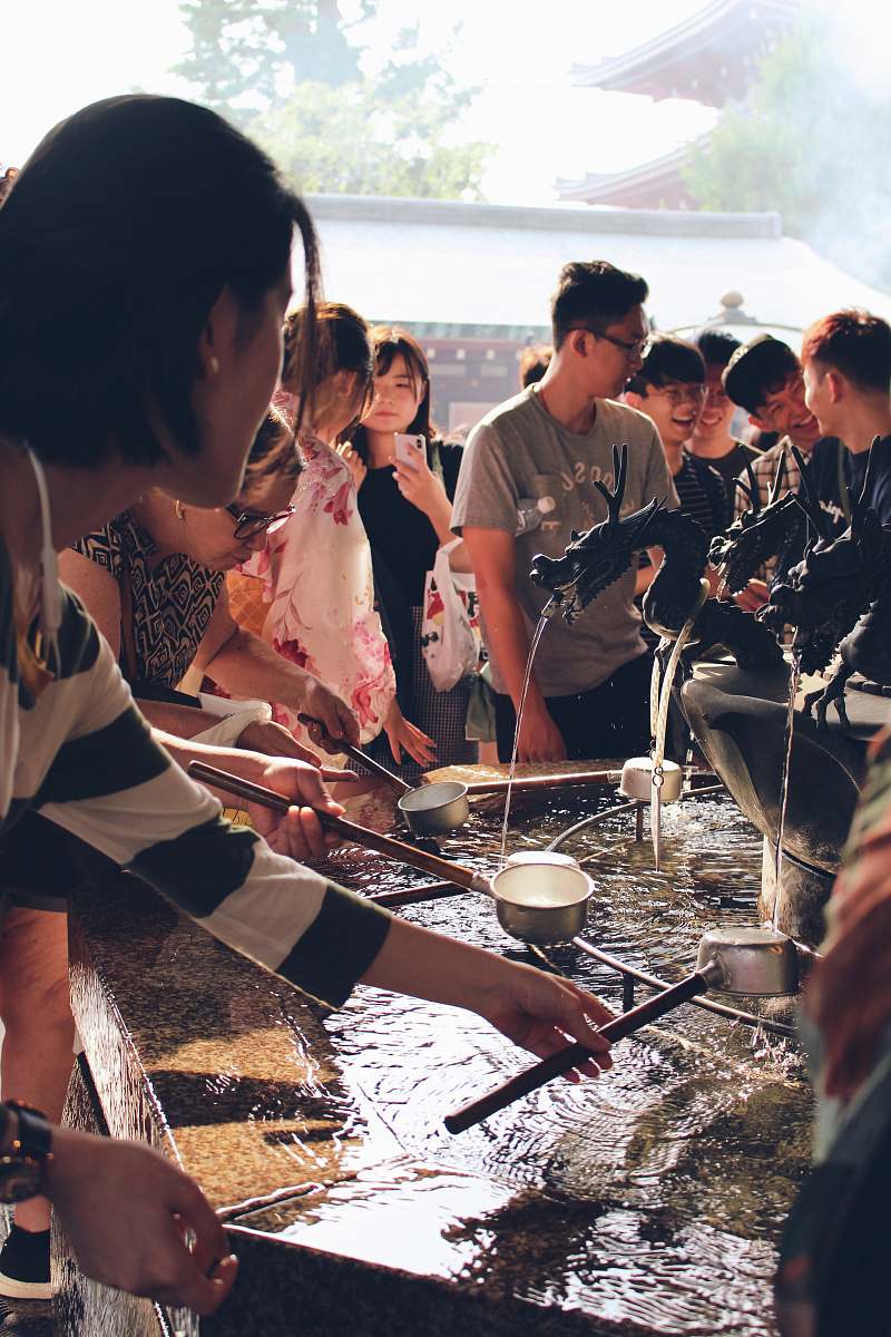 human group of people about to filling water in pots person