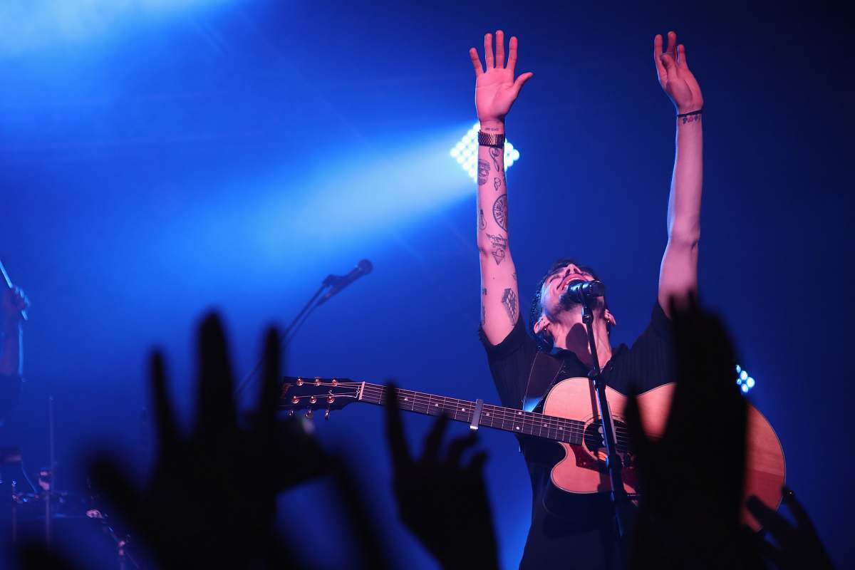 human man raising his hand person