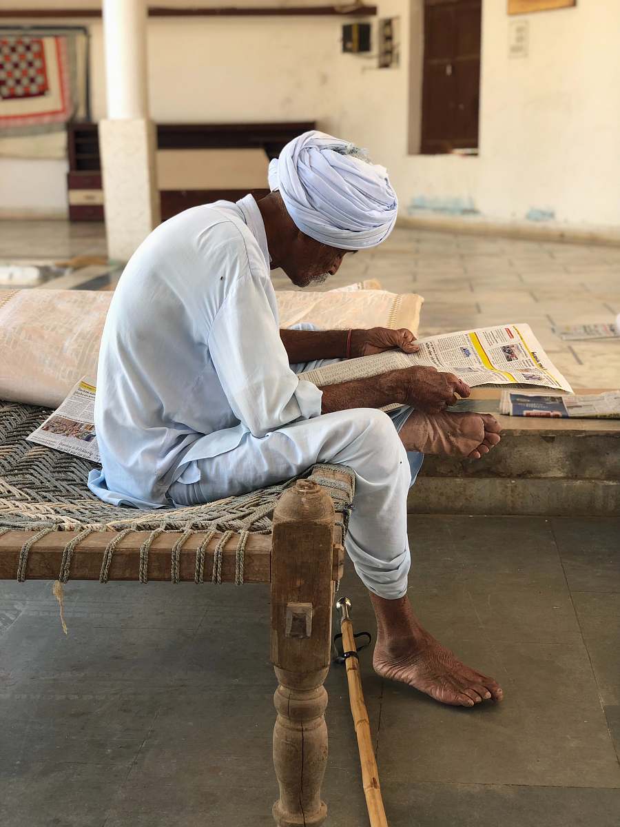 human man sitting on bed person