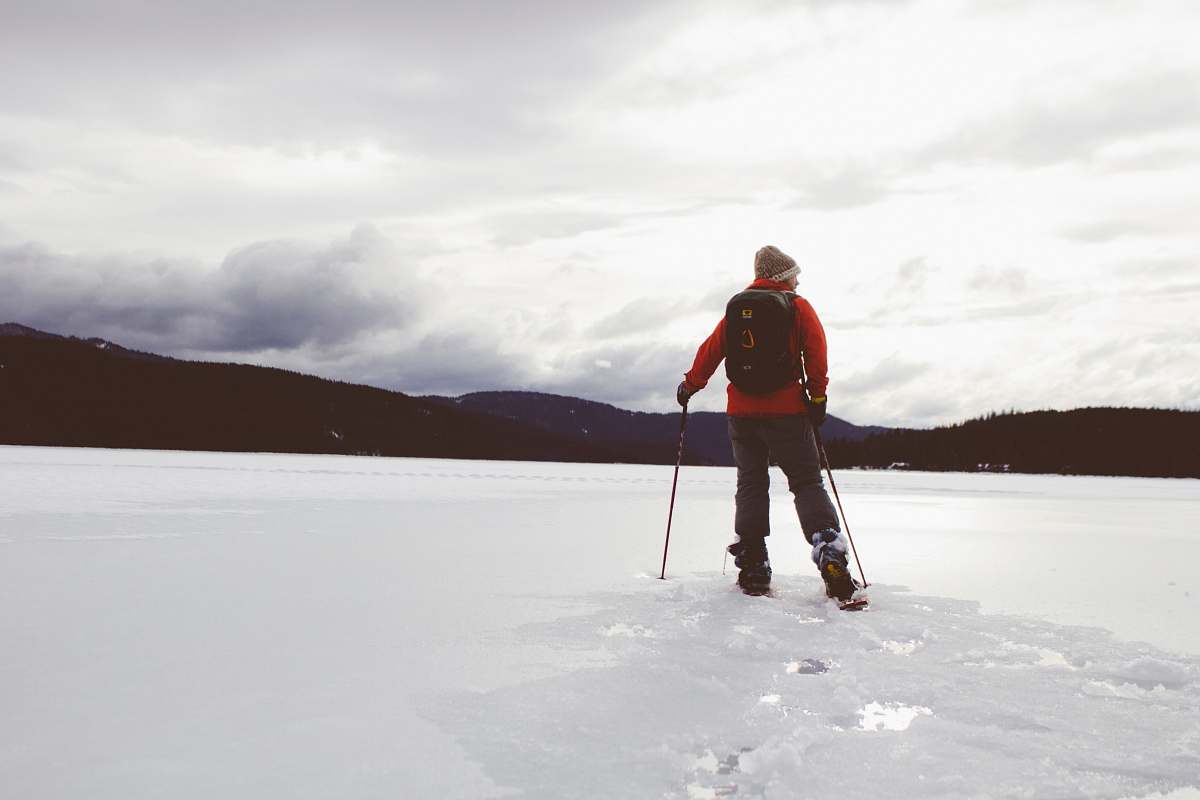 person man standing on snow covered surface human