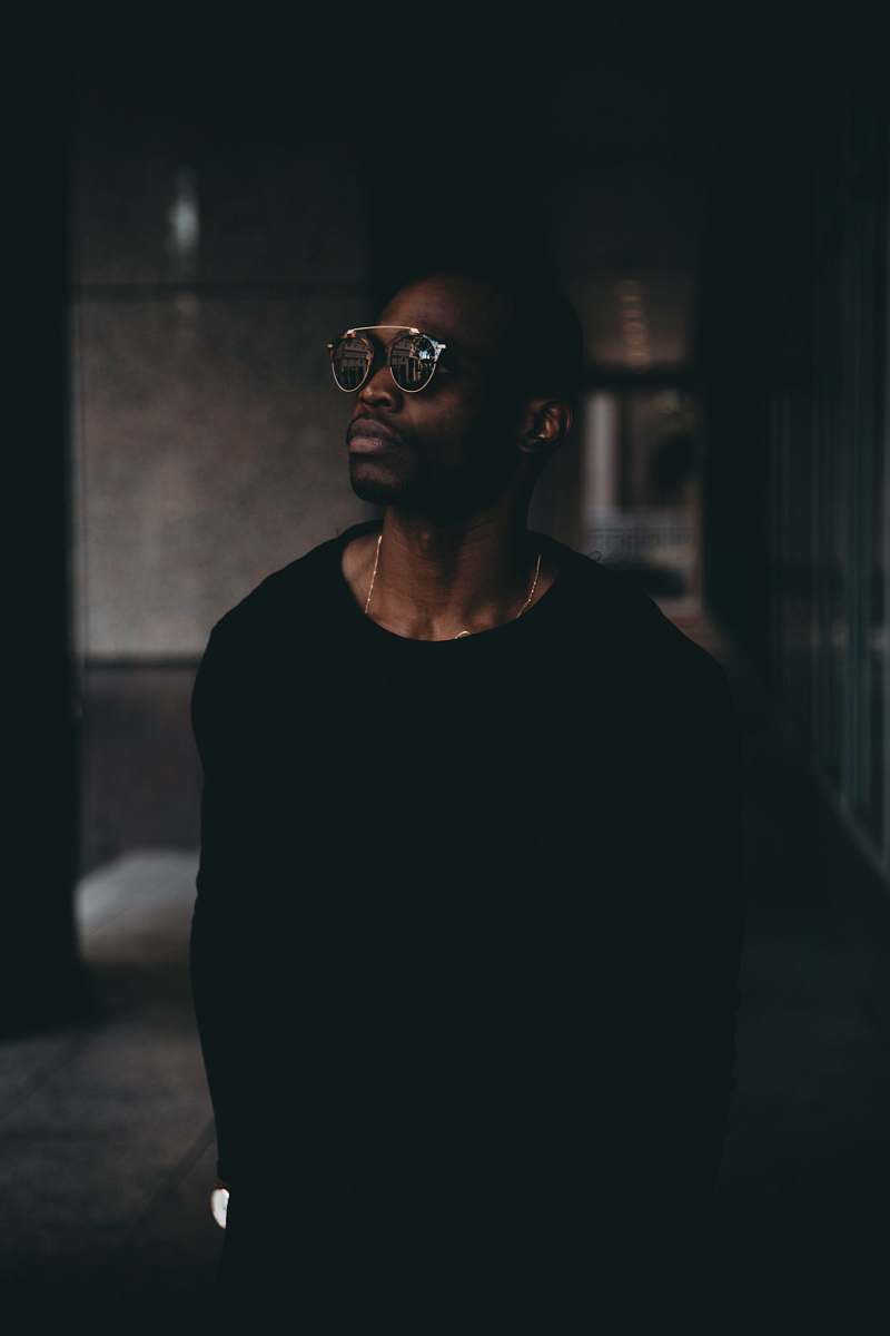 person man wearing black sweatshirt and sunglasses human
