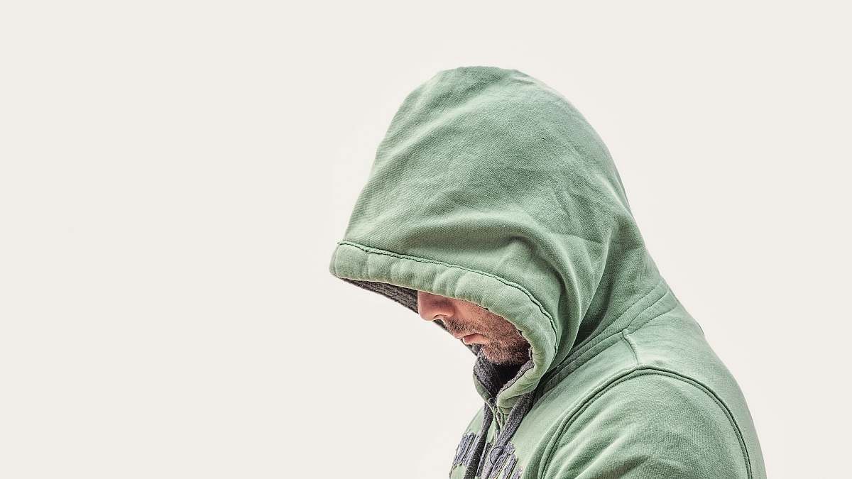 human man wearing green hooded jacket with white background person