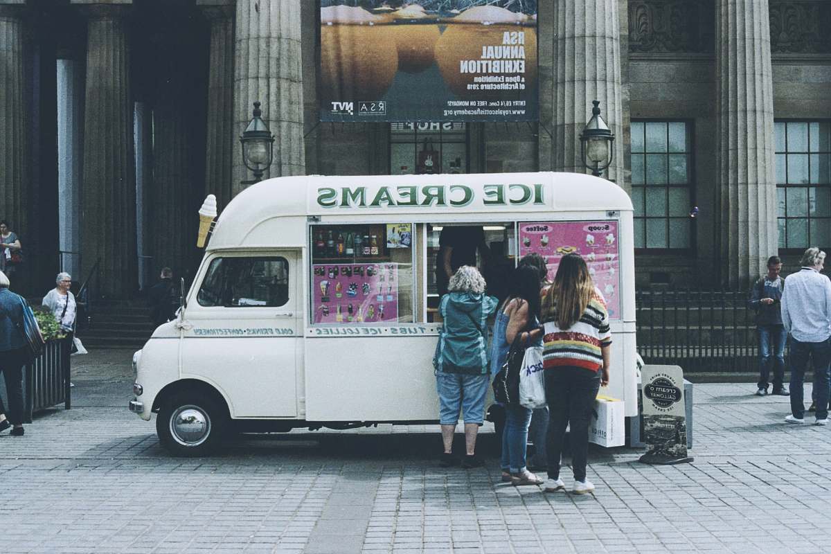 human people lined up at ice cream truck person