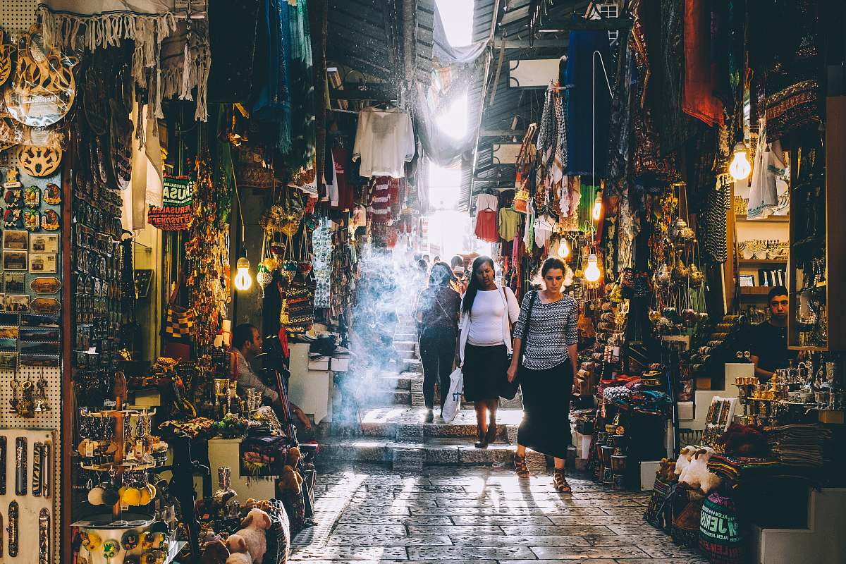 person people walking on market during daytime human