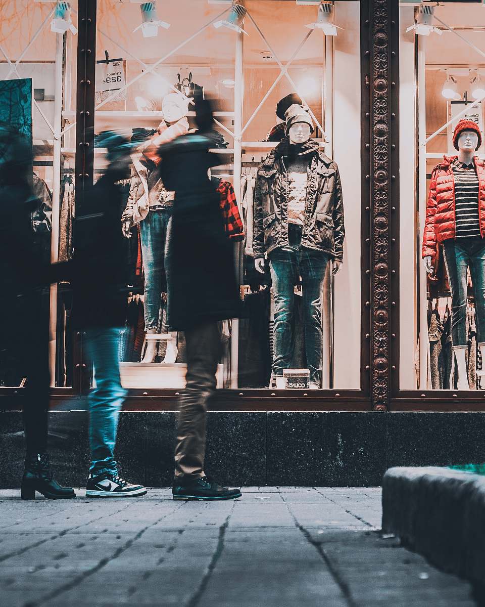 human people watching manequins wearing jackets person