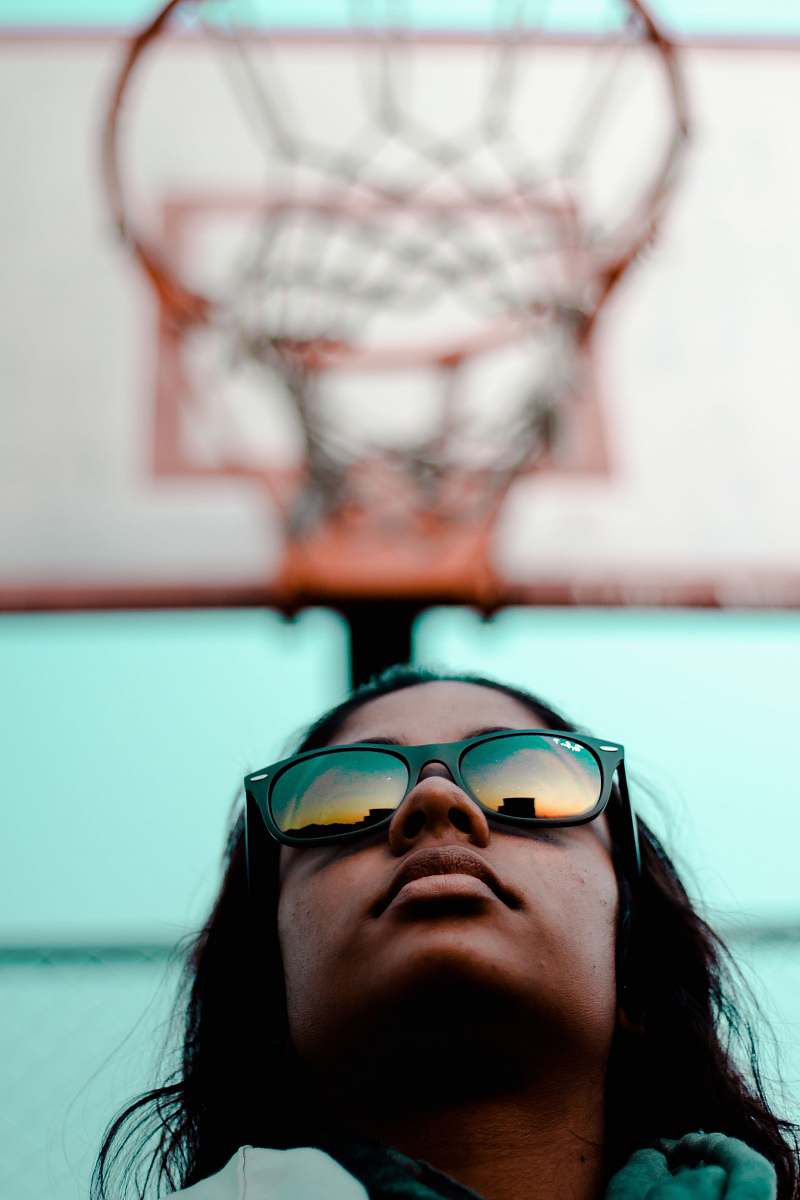 person person wearing black Ray-Ban Wayfarer sunglasses with black frames in worm's eyeview photography during daytime human