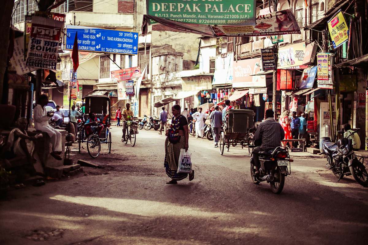 human photo of people on street during daytime motorcycle