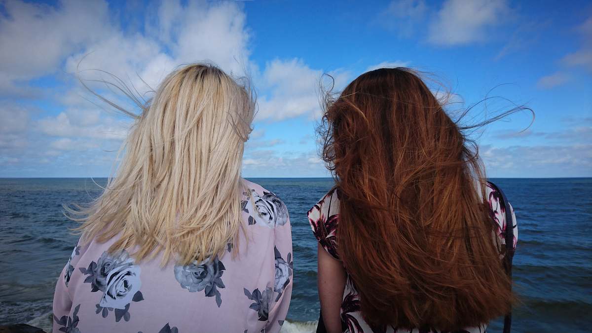 woman photography of two women seeing horizon during daytime blonde