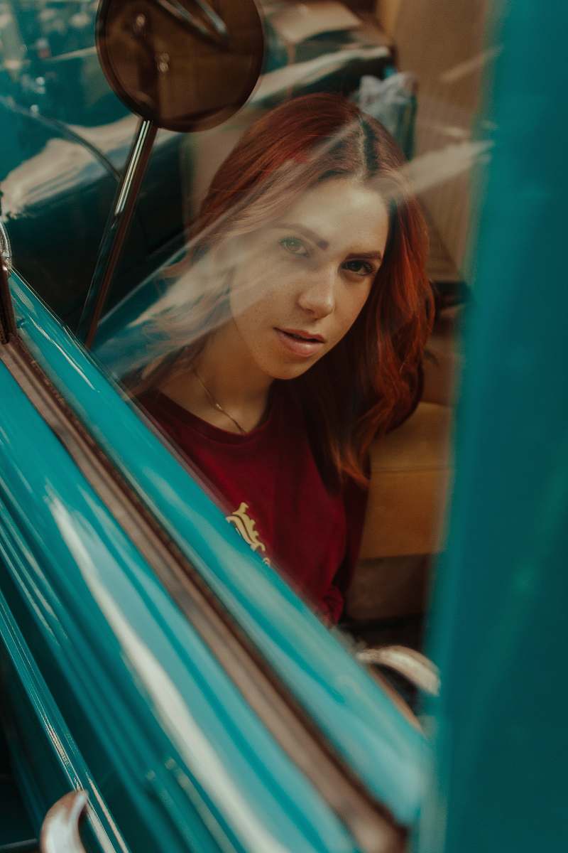 human photography of woman sitting inside the vehicle person
